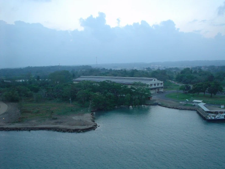 an overhead view of a large building and waterway