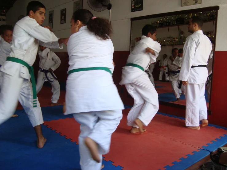 young people in the karate class practicing their moves