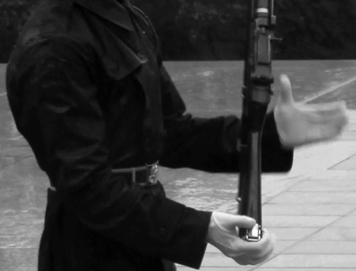 a man is holding a gun in his hand