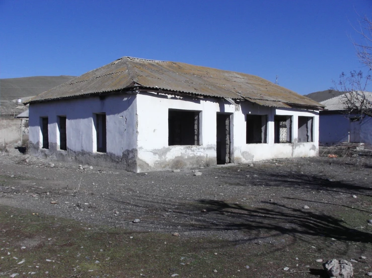 the house has a large grass covered roof