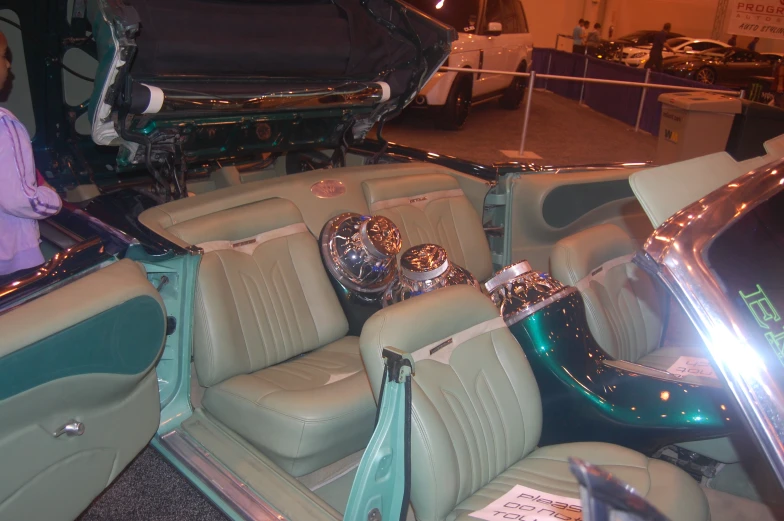 inside of a very nice looking car at a show