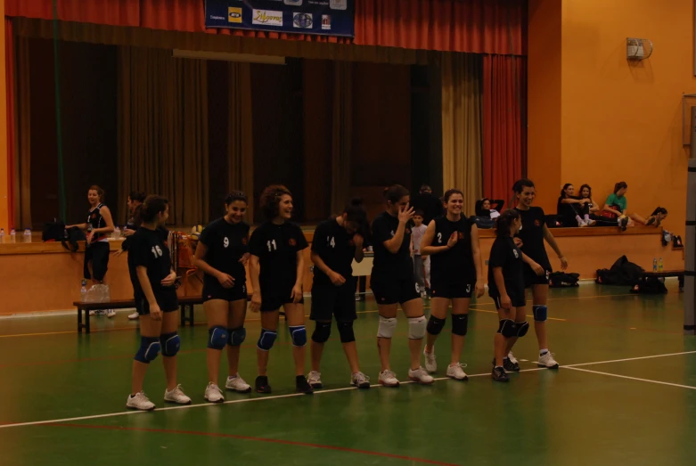 a team on roller blades in uniforms during a competition