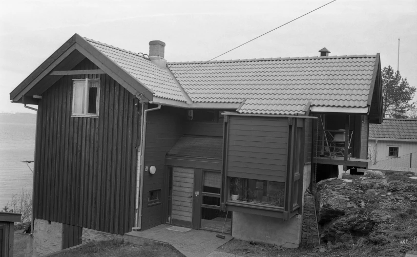 the front side of a house overlooking the water