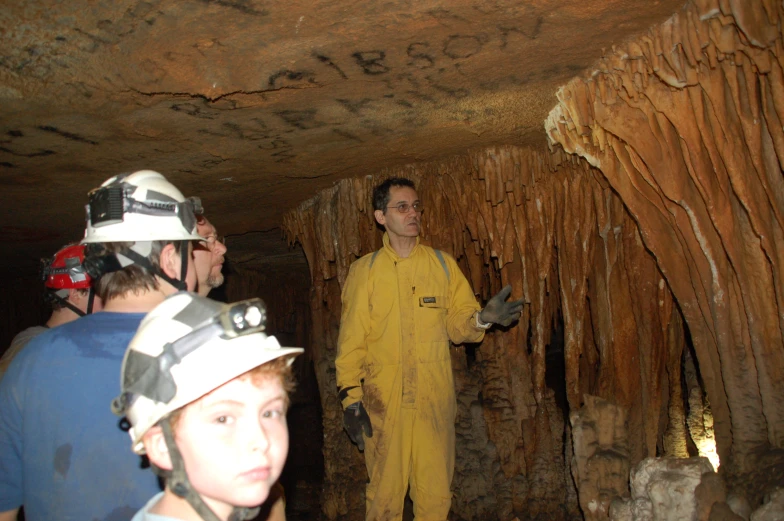 a group of men standing in a cave