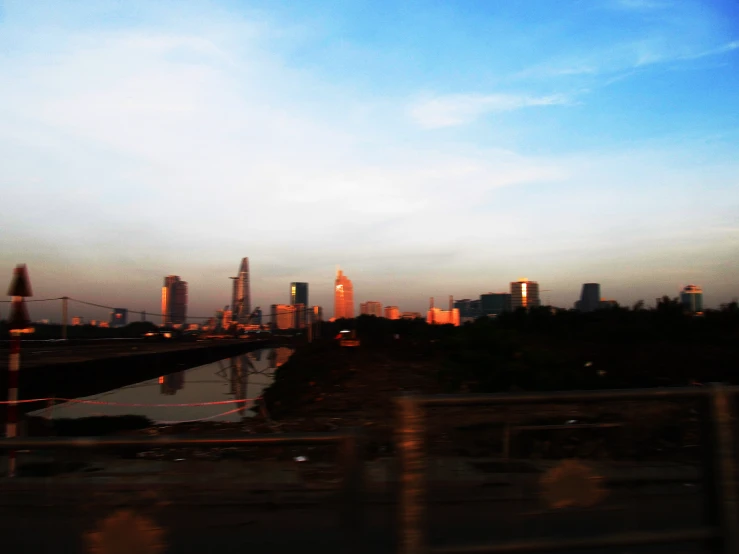 skyline taken from railroad tracks looking toward the water and bridges