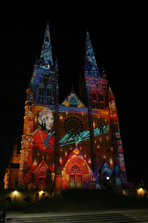 the illuminated building is at night and features a lot of beautiful colors