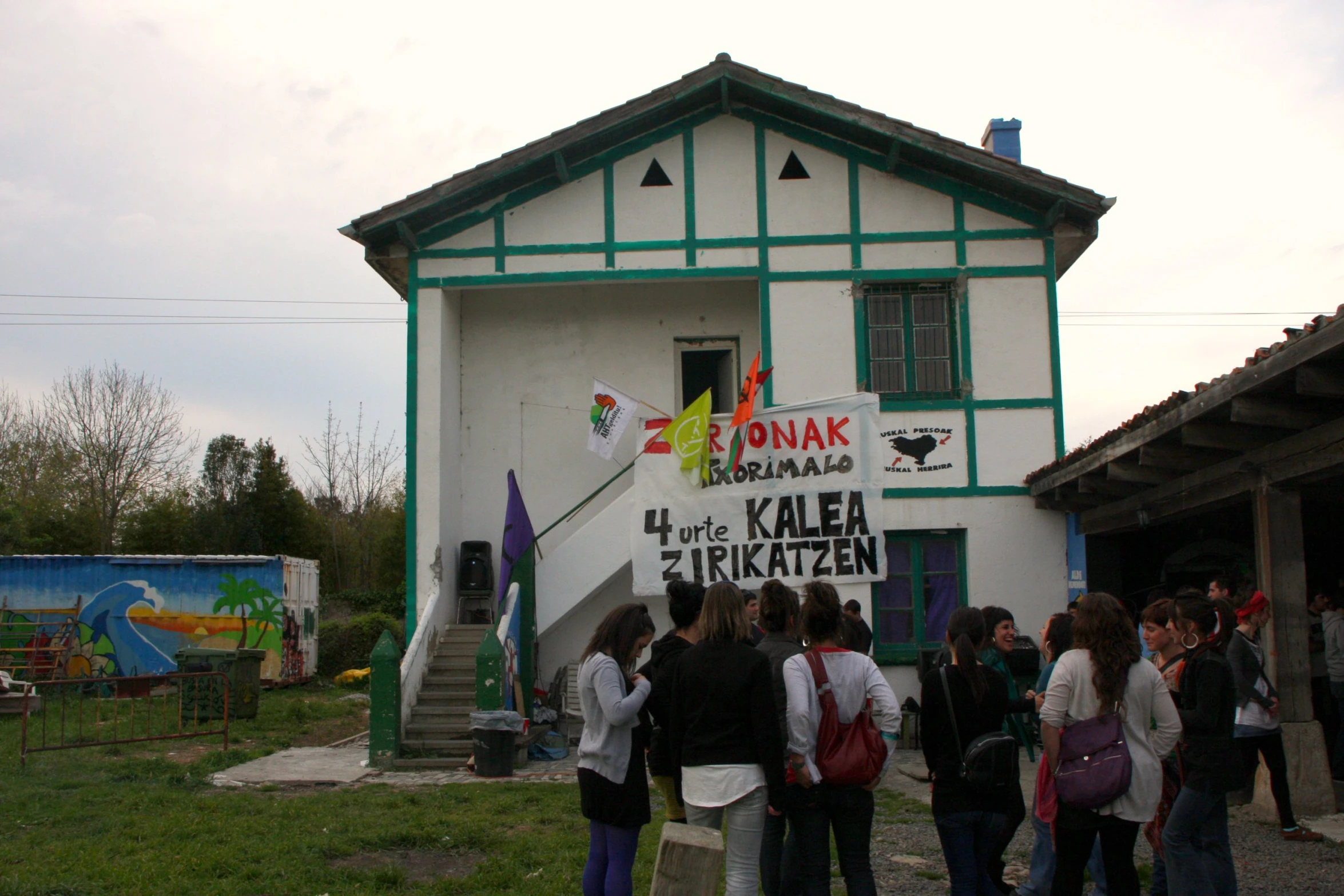 a group of people standing outside of a building