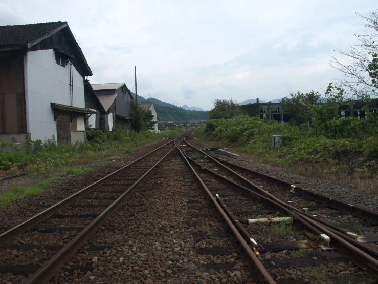 looking down a set of train tracks from the train depot