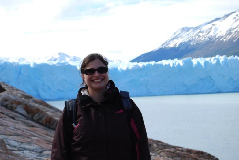 a person standing in front of a body of water