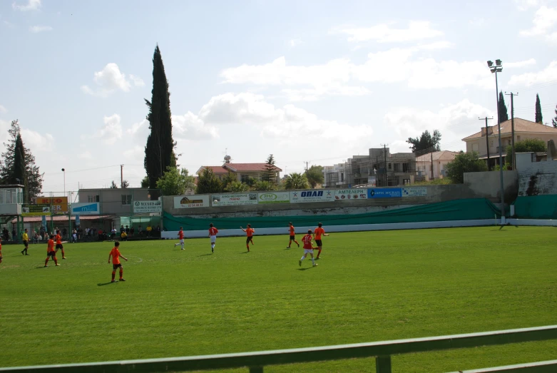 a group of people on a field playing soccer