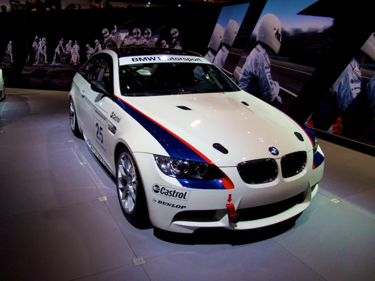bmw car that has a flag on the side