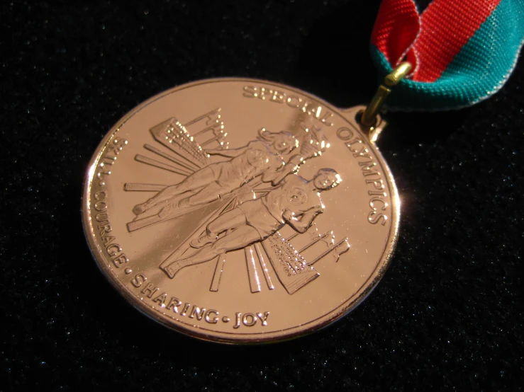 medal with blue, green, and red ribbon