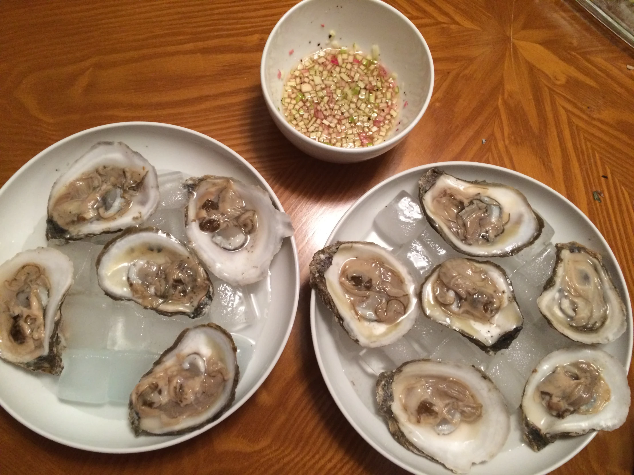 two bowls that have some oysters on them