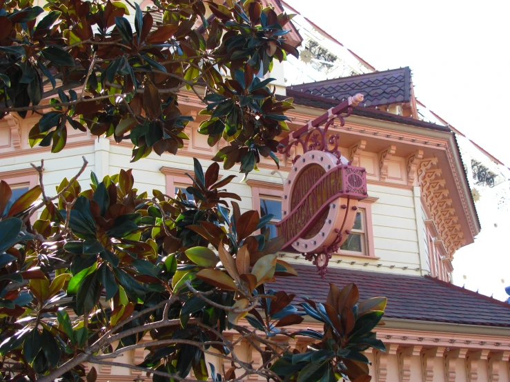 an old building with large signs hanging from it