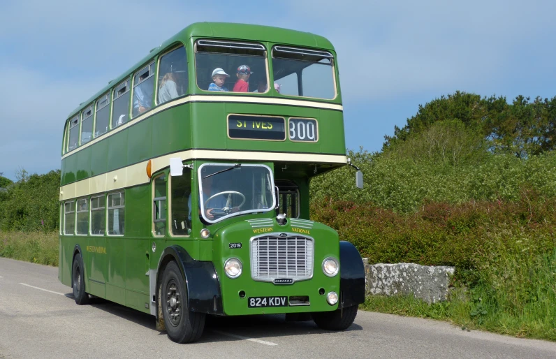 a double decker bus that has people on top of it