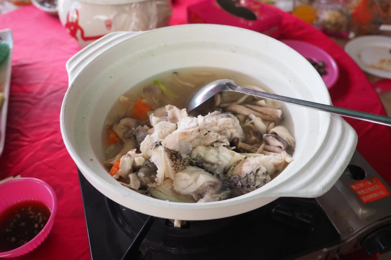 a white bowl containing a mixture of food