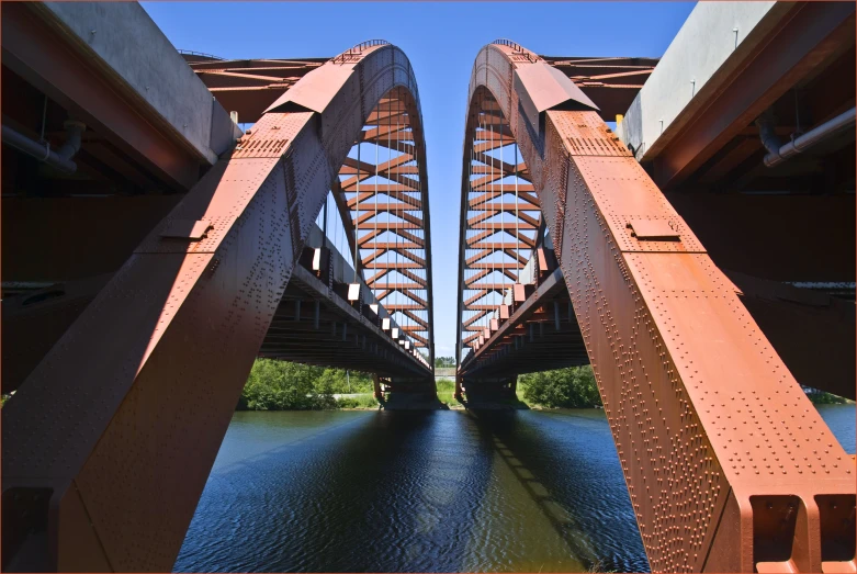 an old bridge is shown from the side and the other side