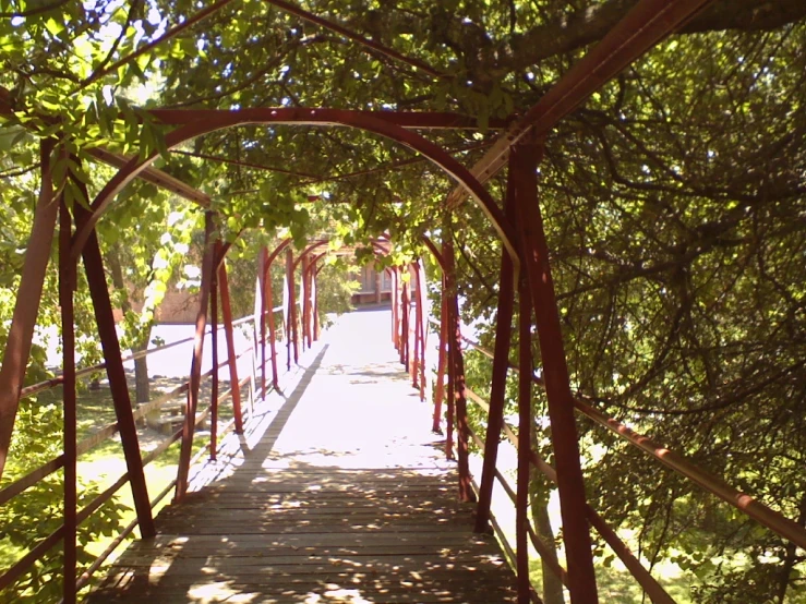 a red path that has a bunch of wooden rails