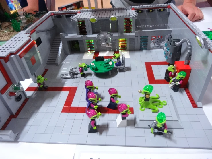 several lego figures set up in a play room