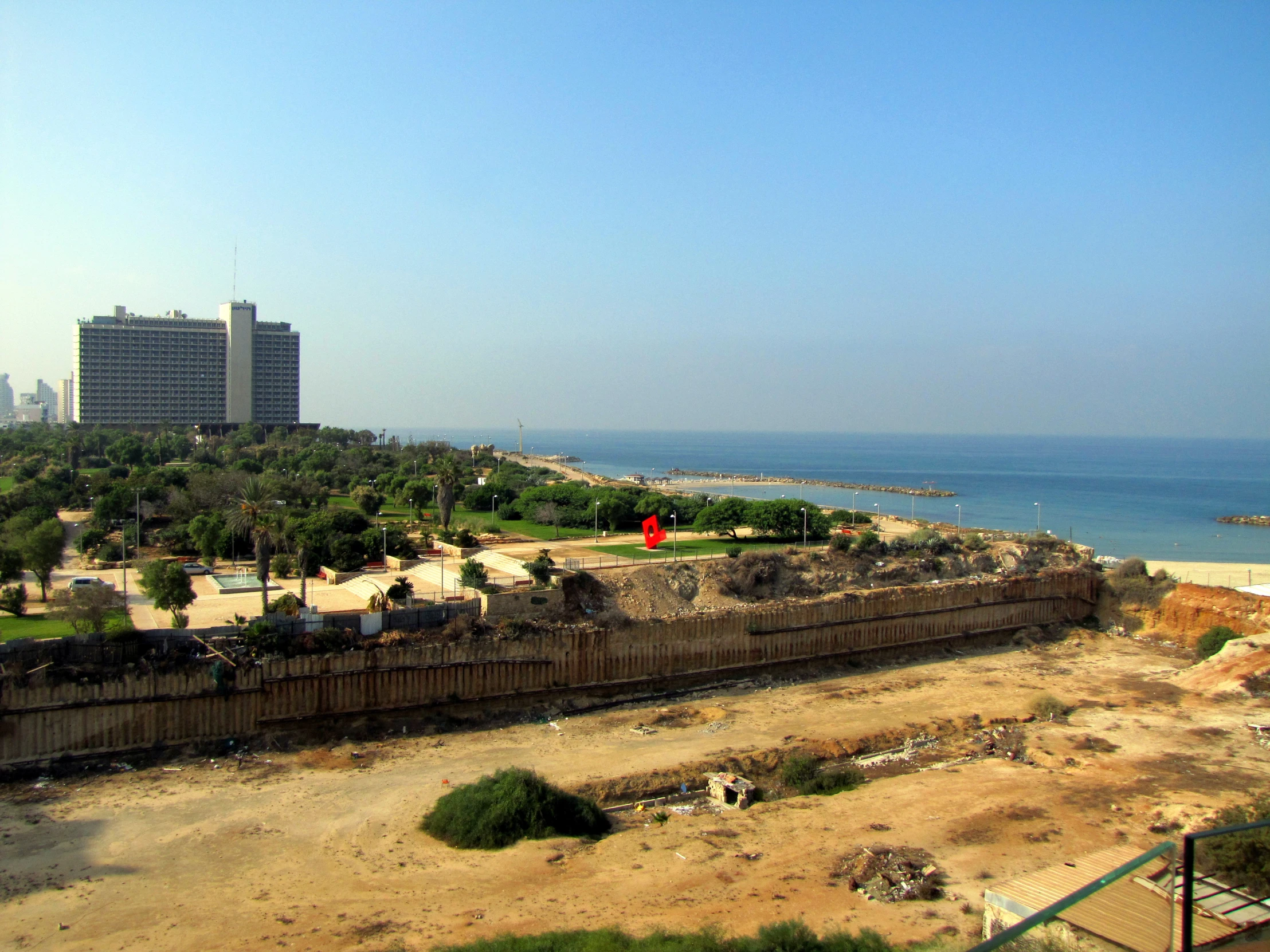 an overview view of a rocky beach area with buildings