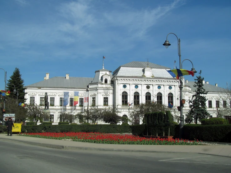 an elegant white building with a circular entrance