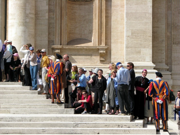 a group of people that are standing on some steps