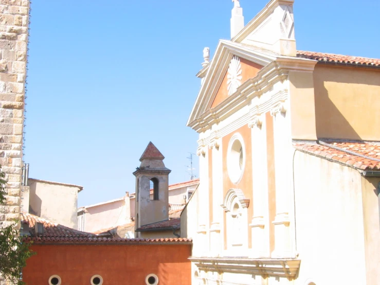 old buildings and a clock tower line a quiet street