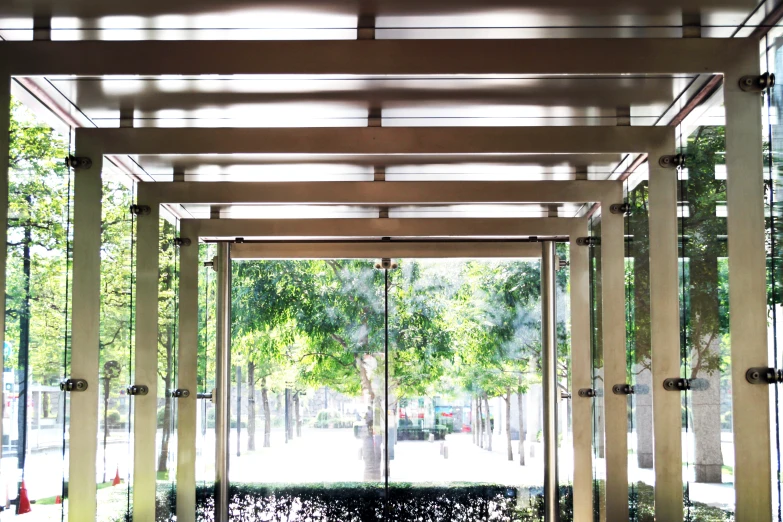 a patio with metal pergolding and benches on either side