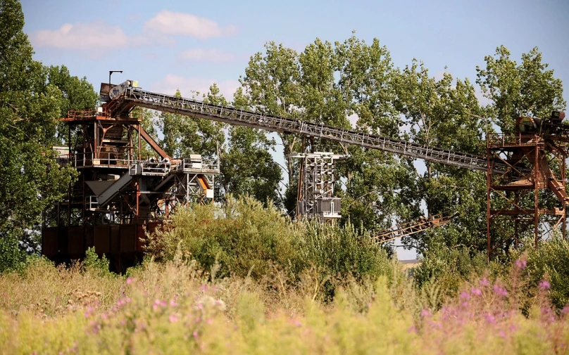 an old conveyor belt in the middle of the jungle