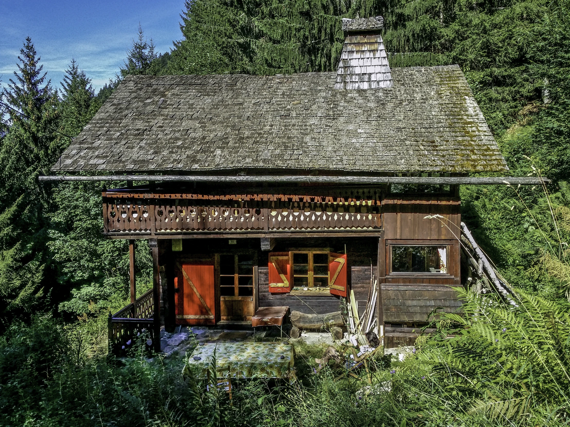 there is a small house made of wood and stone