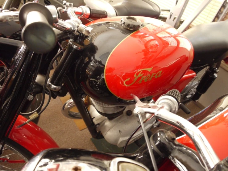 a group of motorcycles are parked in a room