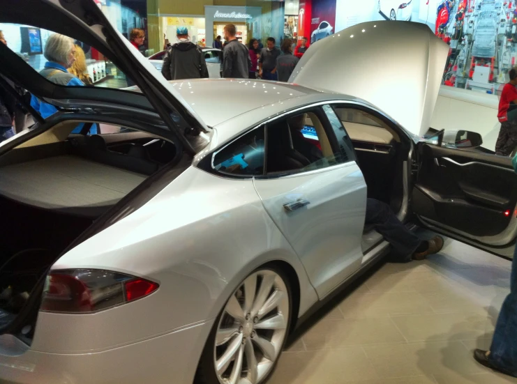 a tesla model s being loaded into its new car at the tesla technology center in washington, d c