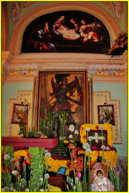 an ornate room with a painting, flowers and pos