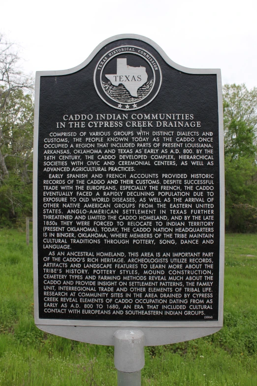 a plaque on the side of a road stating the company's work for the land