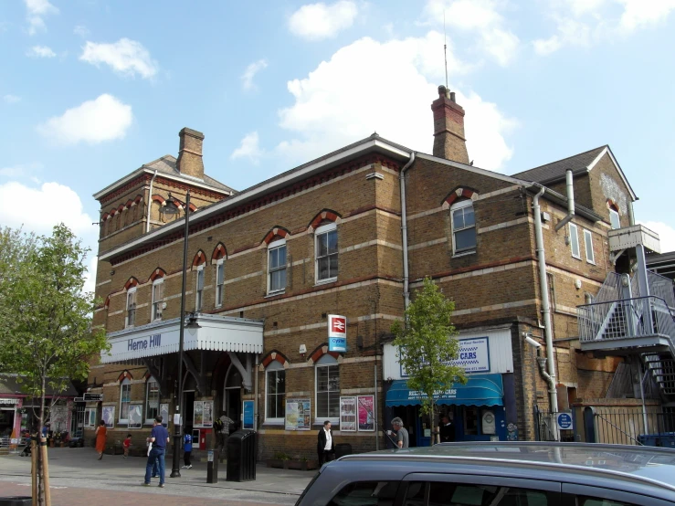 a view of a building that looks like it has shops in front