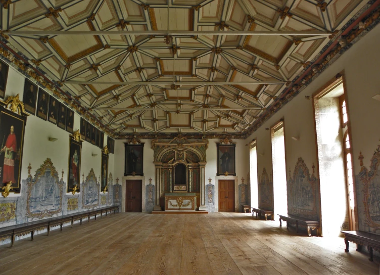 the inside of an old, well - lit building with wooden flooring