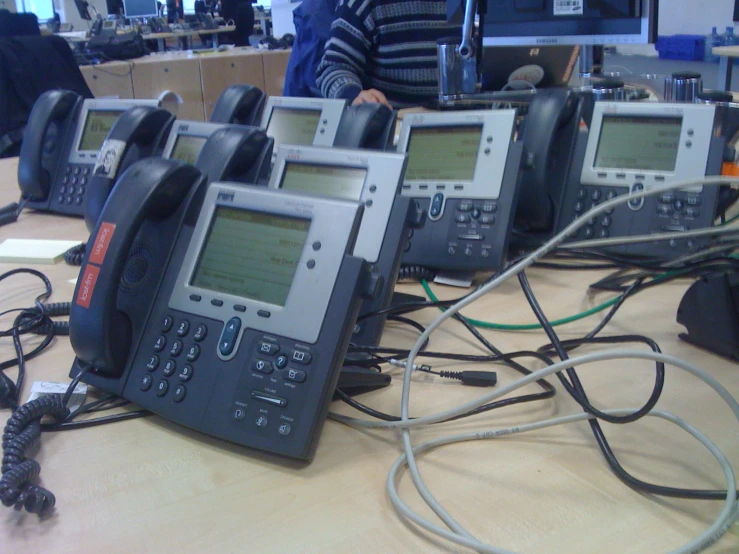 several phones sitting next to each other on a table