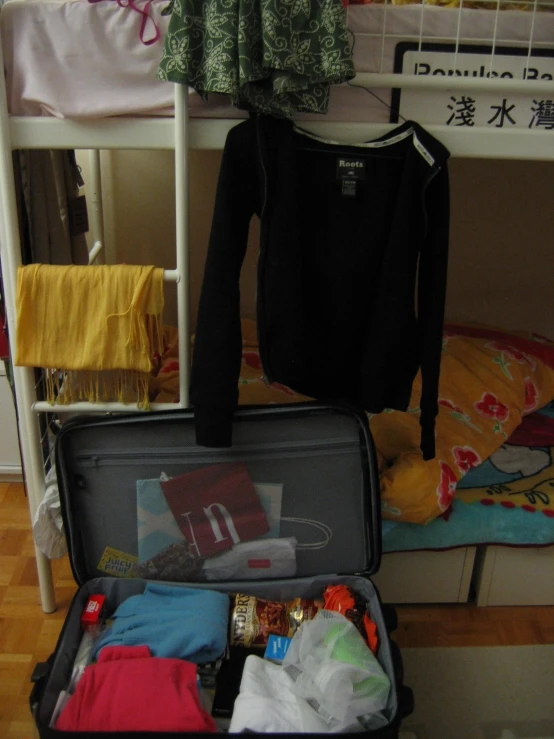 the inside of an open suitcase on the floor