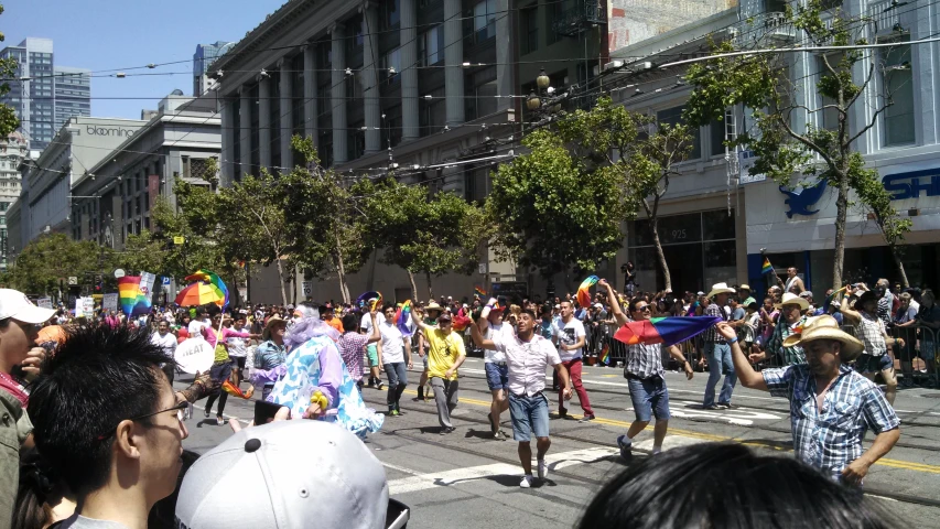 a group of people that are walking down a street