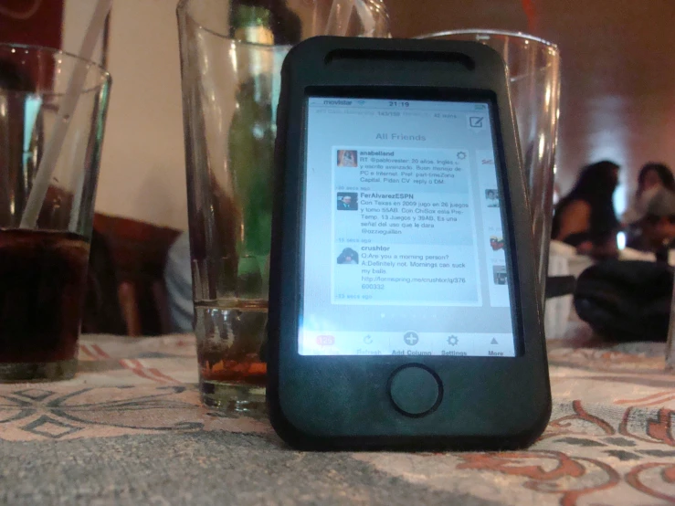 a phone sits on top of an old fashioned table