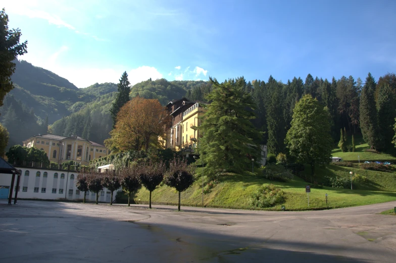 some houses near the mountains on a sunny day