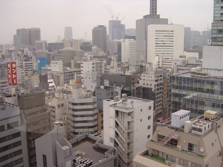 a view of an urban city during a foggy day