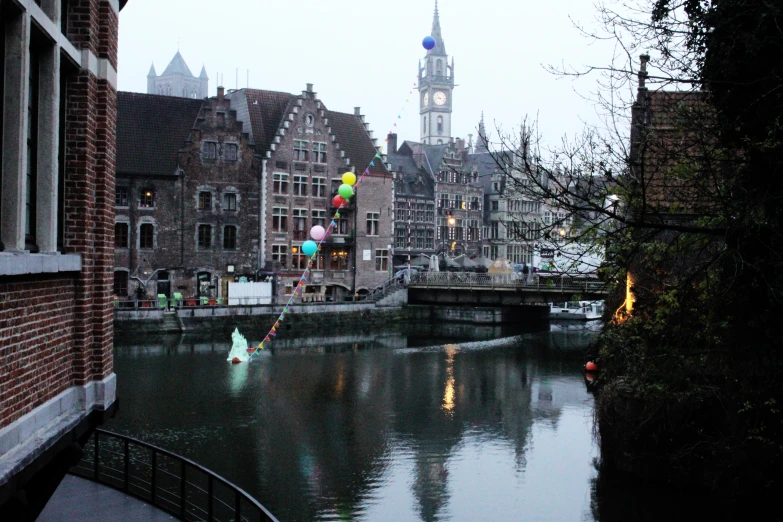 a river running through a city with tall buildings on both sides