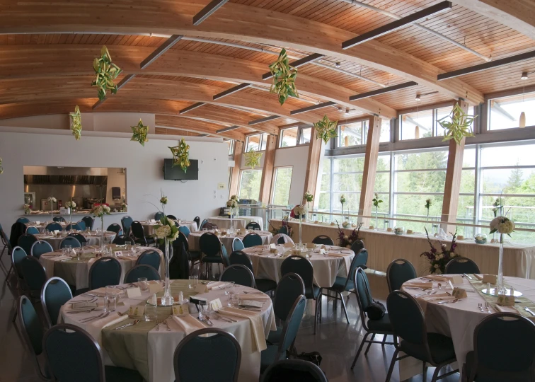 the tables are set up in the center of the large room