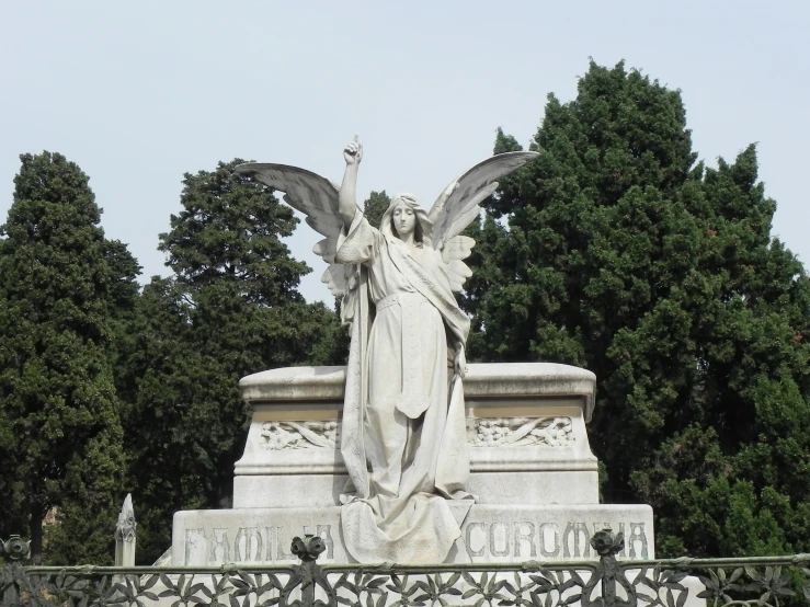 a large angel statue on top of a pedestal