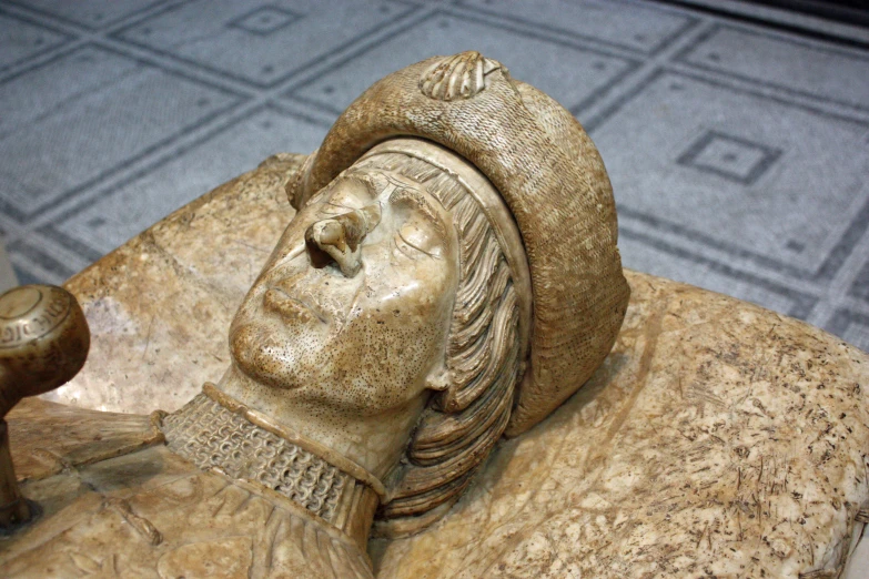 an intricately carved sculpture of a man on a table