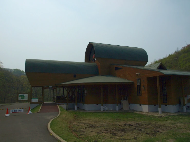 the outside of an old church on a mountain side