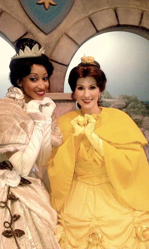 two women are dressed up and posing for the camera