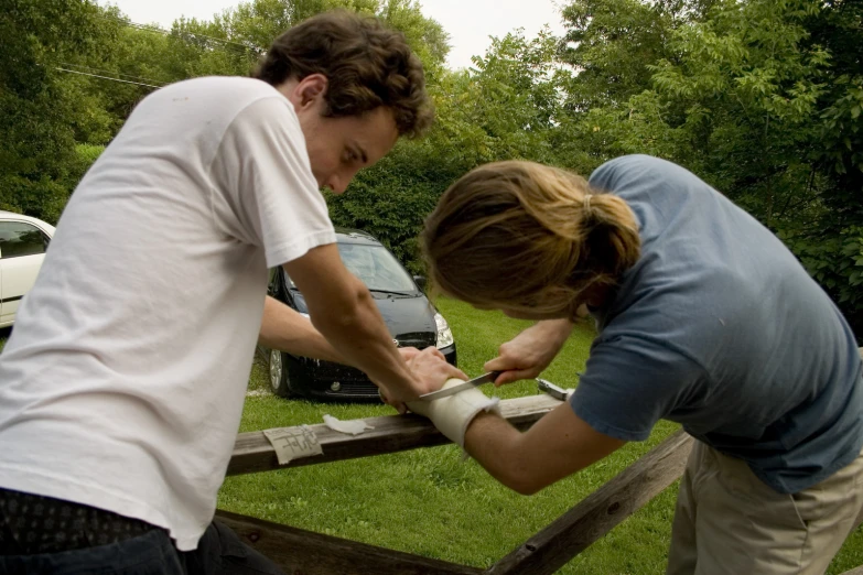 the two people are on their knees holding the hands