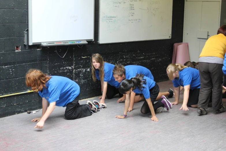 school children are learning the lesson on the chalkboard